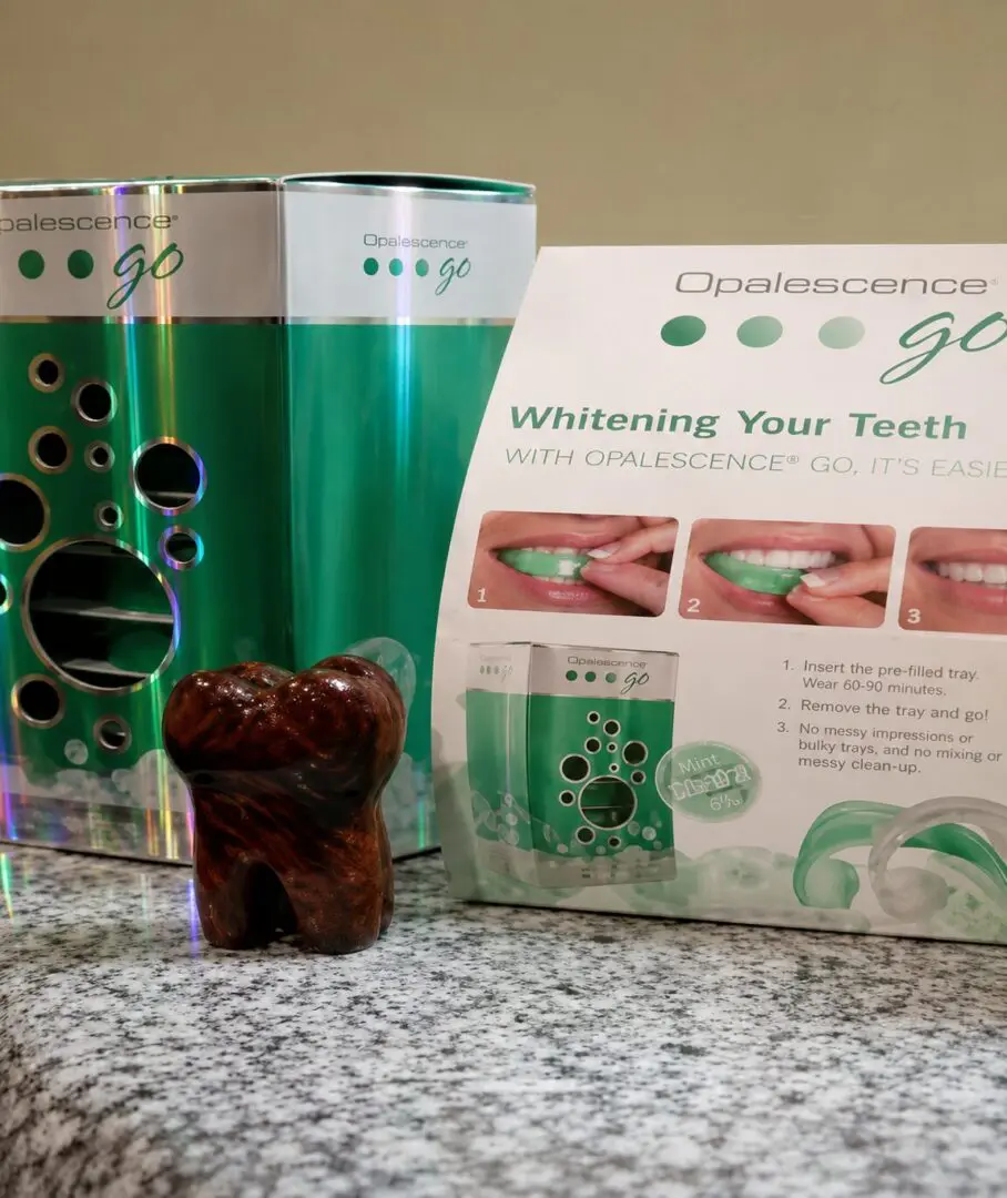 Teeth whitening kit with instructions displayed.